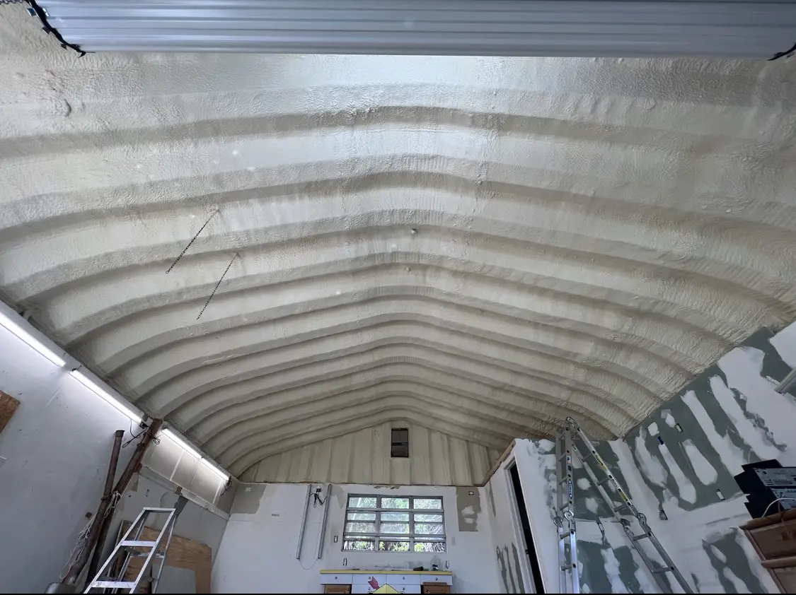 Spray polyurethane foam applied to the underside of a metal roof deck in Bellair-Meadowbrook Terrace